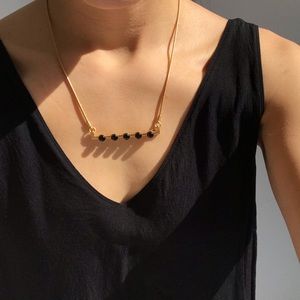 Madewell gold necklace with black stones